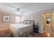 Bright bedroom with a king-size bed and access to the hallway at 1506 S Sheridan Forest Dr, Tampa, FL 33629
