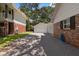 Brick driveway with ample parking space and access to garage at 1506 S Sheridan Forest Dr, Tampa, FL 33629