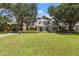 House with manicured lawn and mature trees at 1506 S Sheridan Forest Dr, Tampa, FL 33629