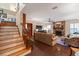Living room with fireplace and stairs leading upstairs at 1506 S Sheridan Forest Dr, Tampa, FL 33629