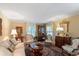 Spacious living room featuring antique furniture and large windows at 1506 S Sheridan Forest Dr, Tampa, FL 33629