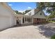 Sunroom addition and brick exterior with a well maintained driveway at 1506 S Sheridan Forest Dr, Tampa, FL 33629