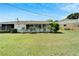 View of backyard showing a large grassy area at 401 Dorchester Pl # 58, Sun City Center, FL 33573
