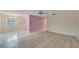 Combined dining and living room with laminate flooring at 401 Dorchester Pl # 58, Sun City Center, FL 33573