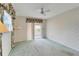Bright bedroom featuring a sliding door to a patio at 401 Dorchester Pl # 58, Sun City Center, FL 33573