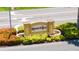 Photo of the community entrance sign, Kings Point, nicely landscaped at 401 Dorchester Pl # 58, Sun City Center, FL 33573