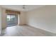 Spacious bedroom with laminate wood flooring and sliding glass doors to patio at 401 Dorchester Pl # 58, Sun City Center, FL 33573
