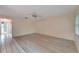 Spacious living room with light walls and laminate floors at 401 Dorchester Pl # 58, Sun City Center, FL 33573