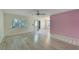 Open living room with laminate floors and a view into dining area at 401 Dorchester Pl # 58, Sun City Center, FL 33573
