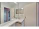 Bathroom with a vanity, large mirror, and access to the shower at 401 Dorchester Pl # 58, Sun City Center, FL 33573