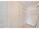 Large walk-in closet with wire shelving and a hanging rod at 401 Dorchester Pl # 58, Sun City Center, FL 33573