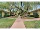 Nice community view with lush landscaping and walkways at 401 Dorchester Pl # 58, Sun City Center, FL 33573