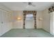 Spacious bedroom with window, carpet, and built-in closet at 401 Dorchester Pl # 58, Sun City Center, FL 33573