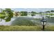 Scenic lake view with lush landscaping at 1655 S Highland Ave # J390, Clearwater, FL 33756