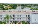 View of building exterior with balconies and lake view at 1655 S Highland Ave # J390, Clearwater, FL 33756