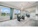 Dining area with lake view and glass table at 1655 S Highland Ave # J390, Clearwater, FL 33756