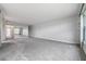 Large living room with mirrored wall and carpet at 1655 S Highland Ave # J390, Clearwater, FL 33756