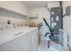Laundry room with washer, dryer, and extra shelving at 1655 S Highland Ave # J390, Clearwater, FL 33756