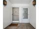 Condo entryway with two doors and a welcome mat at 1655 S Highland Ave # J390, Clearwater, FL 33756