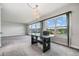 Dining area with lake view and glass table at 1655 S Highland Ave # J390, Clearwater, FL 33756