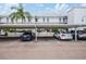 Covered parking area with several cars parked underneath at 1655 S Highland Ave # J390, Clearwater, FL 33756