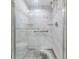 Large walk-in shower with marble tile and glass enclosure at 1655 S Highland Ave # J390, Clearwater, FL 33756