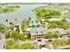 Aerial view of community pool and clubhouse overlooking the lake at 617 Islebay Dr, Apollo Beach, FL 33572