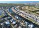 Beautiful aerial view of waterfront homes along canals leading to Tampa Bay with lush landscaping and golf course at 617 Islebay Dr, Apollo Beach, FL 33572