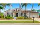 Beautiful single-story home with a welcoming front porch, dormers, and a well-kept lawn at 617 Islebay Dr, Apollo Beach, FL 33572