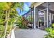 Screened in porch and lush, mature landscaping surround this beautiful home at 617 Islebay Dr, Apollo Beach, FL 33572