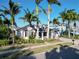 Charming home featuring lush tropical landscaping and a two-car garage at 617 Islebay Dr, Apollo Beach, FL 33572