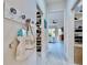 Hallway leading to the bedroom features a decorative bag, closet, and coordinated neutral wall color at 617 Islebay Dr, Apollo Beach, FL 33572