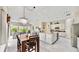 Modern kitchen with stainless steel appliances, granite countertops, and an island at 617 Islebay Dr, Apollo Beach, FL 33572