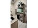 Functional laundry area with utility sink, floating shelves, and organized storage solutions at 617 Islebay Dr, Apollo Beach, FL 33572