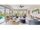 Bright and airy living room with water views, comfortable seating, and stylish decor at 617 Islebay Dr, Apollo Beach, FL 33572