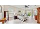 Spacious bedroom with ceiling fan, light walls, plenty of natural light, and stylish, coordinated furnishings at 617 Islebay Dr, Apollo Beach, FL 33572