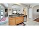 Kitchen with breakfast bar and view into living room at 13951 Caden Glen Dr, Hudson, FL 34669