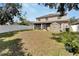 Spacious backyard with two-story home and shed at 13951 Caden Glen Dr, Hudson, FL 34669
