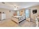 Large main bedroom with carpeted floor and ceiling fan at 13951 Caden Glen Dr, Hudson, FL 34669