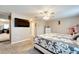 Main bedroom with large TV and walk-in closet at 13951 Caden Glen Dr, Hudson, FL 34669