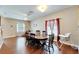 Bright dining room featuring a wood table and chairs, hardwood floors, and ample natural light at 13951 Caden Glen Dr, Hudson, FL 34669