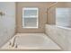 Bathroom featuring a large, free-standing tub at 13951 Caden Glen Dr, Hudson, FL 34669