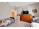 Bedroom with twin bed, dresser and TV at 13951 Caden Glen Dr, Hudson, FL 34669