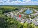 Aerial view showing home location near a lake at 13951 Caden Glen Dr, Hudson, FL 34669