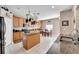 Spacious kitchen with island, granite countertops, and wood cabinets at 13951 Caden Glen Dr, Hudson, FL 34669