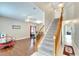 Bright and spacious entryway with hardwood floors and staircase at 13951 Caden Glen Dr, Hudson, FL 34669