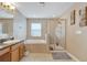 Bathroom with soaking tub and walk-in shower at 13951 Caden Glen Dr, Hudson, FL 34669