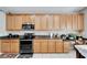 Spacious kitchen with granite countertops and modern appliances at 13951 Caden Glen Dr, Hudson, FL 34669