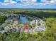 Aerial view showing home location near a lake at 13951 Caden Glen Dr, Hudson, FL 34669
