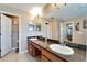 Double vanity bathroom with granite countertops at 13951 Caden Glen Dr, Hudson, FL 34669